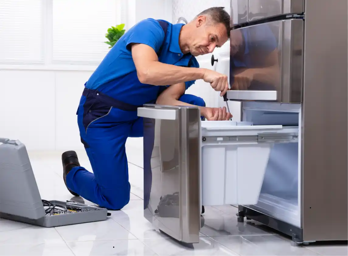 Swift Appliance Solution technician repairing a freezer in Toronto