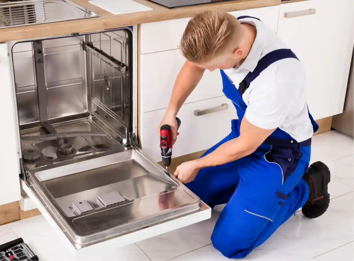 Swift Appliance Solution technician repairing a dishwasher in Toronto