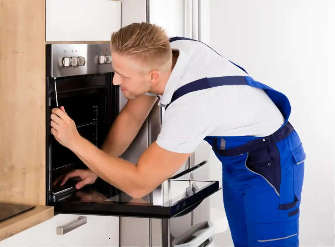 Swift Appliance Solution technician repairing an oven in Toronto
