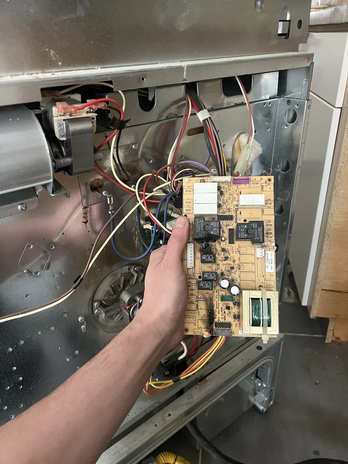 Oven control board removed for replacement