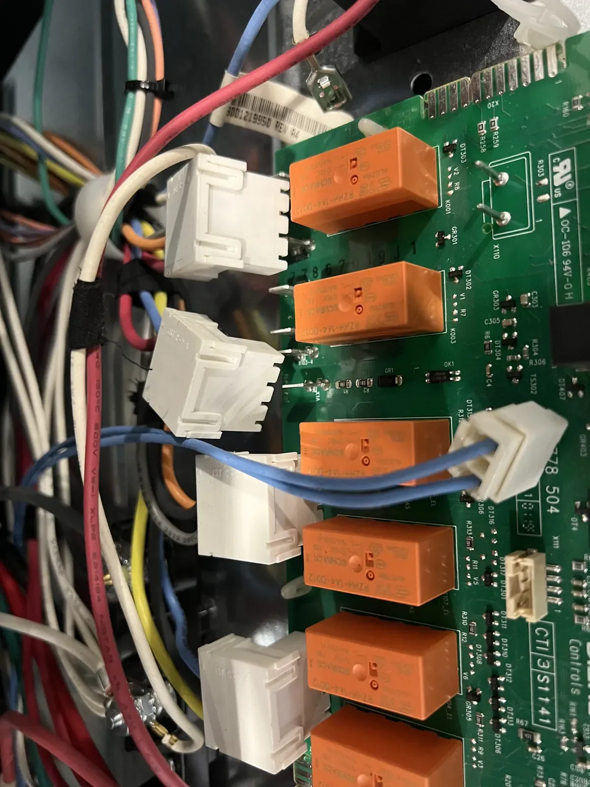 Microwave relay board close-up during repair